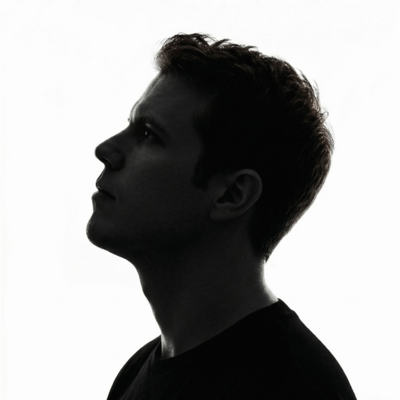 Black and white side profile of Travis Marceau